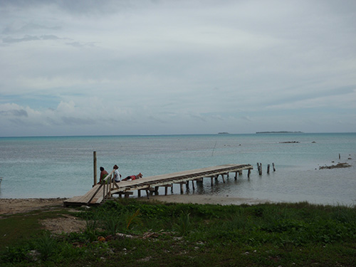 Locals hanging out on the docks by the lagoon Locals hanging out on the docks by the lagoon