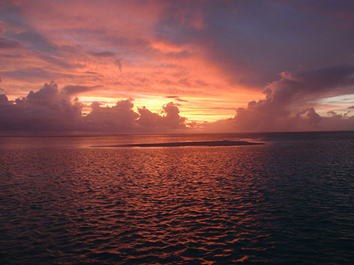 Sunset over Aitutaki's lagoon Sunset over Aitutaki's lagoon