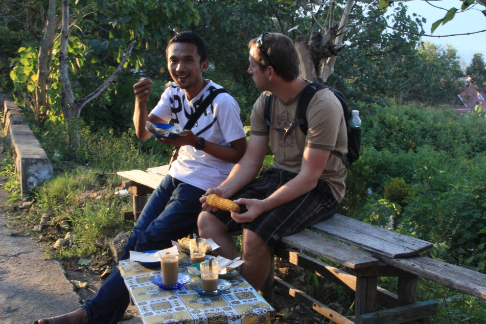 Rycko and Jason eat corn in Sungai Penuh